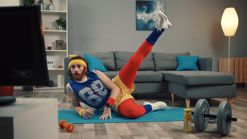 Man in Colorful Clothes Exercising at Home